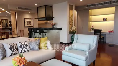 Spacious modern living room with elegant decor and open kitchen layout, perfect for stylish urban living.