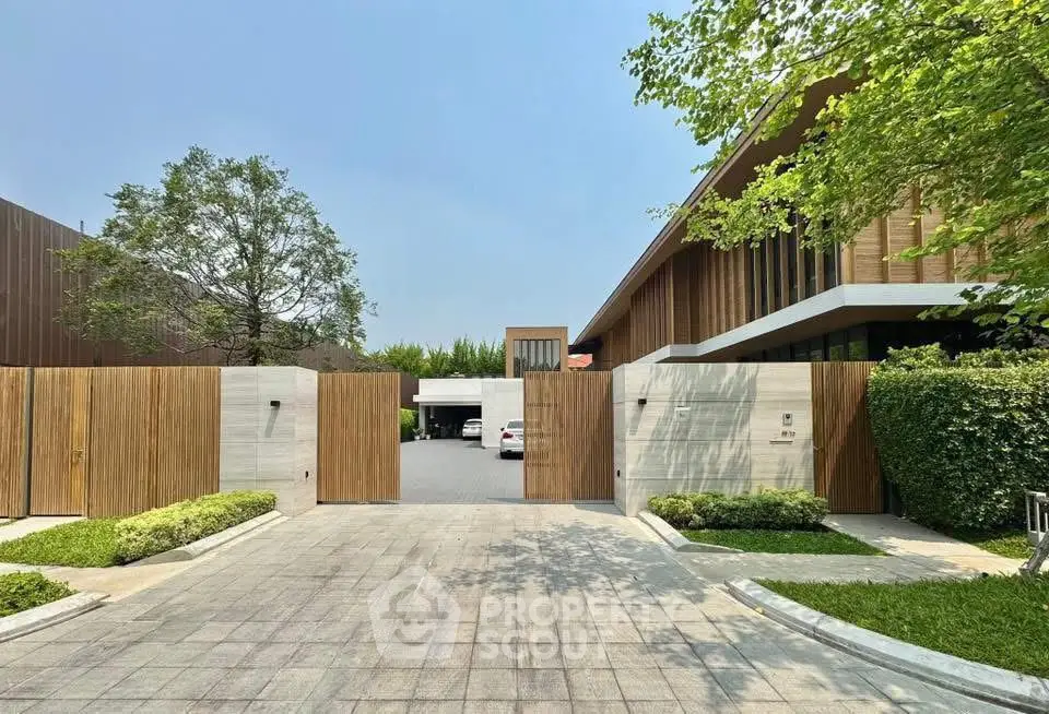 Modern luxury home with wooden facade and spacious driveway