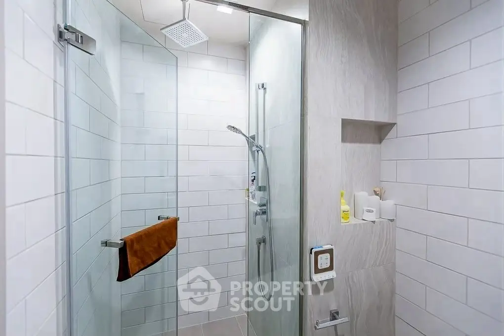Modern bathroom with glass shower and sleek tile design