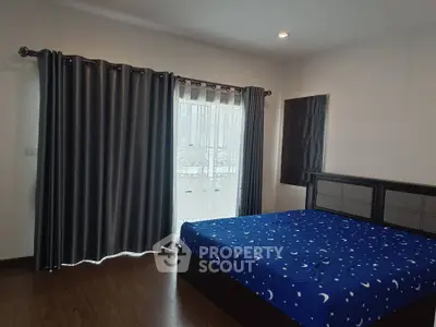 Spacious bedroom with elegant curtains and stylish bed frame