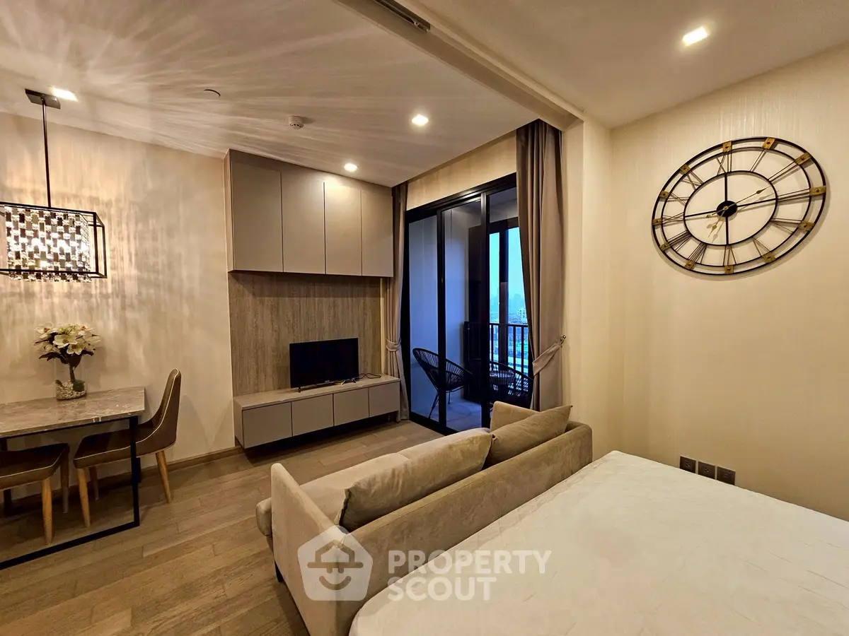 Modern living room with stylish decor and balcony view in a luxury apartment