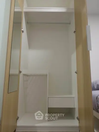 Spacious walk-in closet with modern design and ample storage space