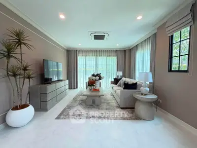 Elegant living room with modern decor, large windows, and cozy seating area, perfect for relaxation and entertainment.
