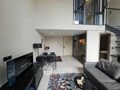 Modern loft apartment with stylish living area and open kitchen design.