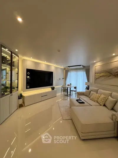 Luxurious modern living room with elegant decor and spacious seating area.