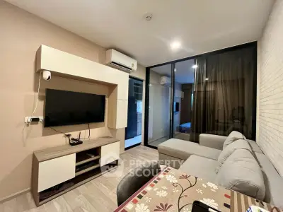 Modern living room with sleek design and cozy ambiance, featuring a wall-mounted TV and stylish furniture.