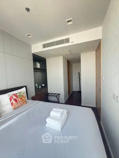 Spacious modern bedroom with elegant decor and natural light