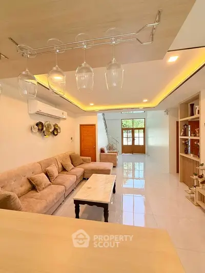 Spacious living room with elegant decor and ample natural light