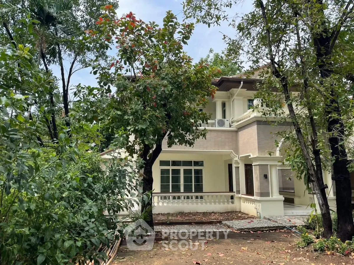 Charming two-story house with lush garden and spacious balcony