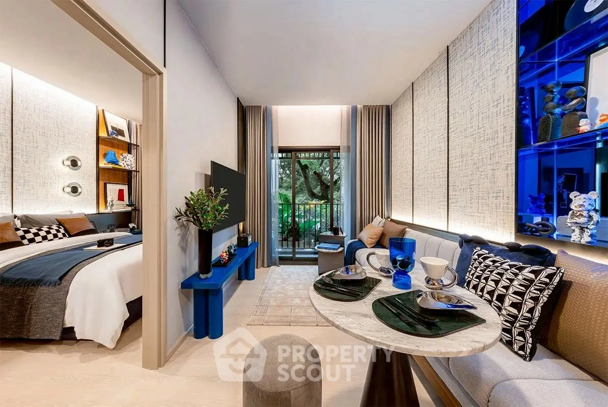 Modern living room with stylish decor and small balcony view, perfect for urban living.