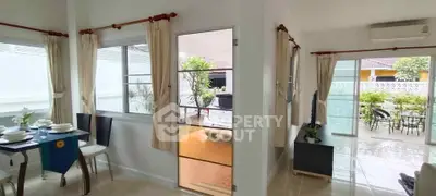 Bright and airy living space with dining area and garden view, perfect for modern living.