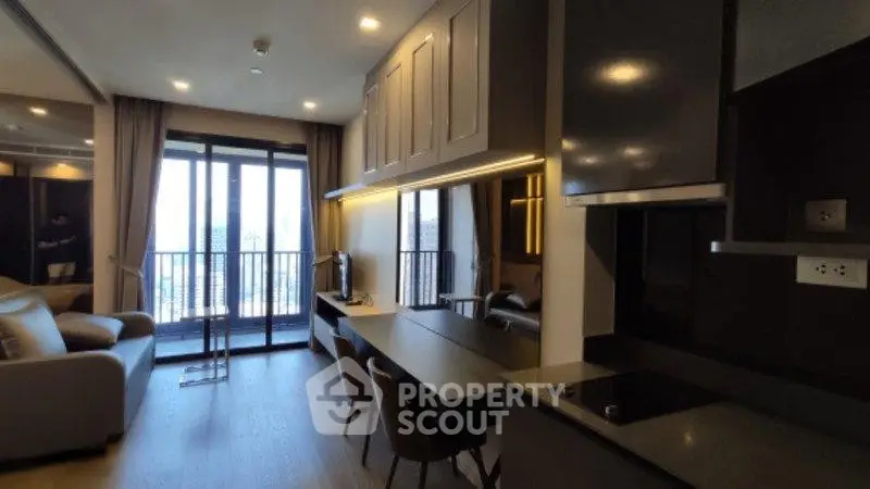 Modern living room with open kitchen and balcony view in luxury apartment