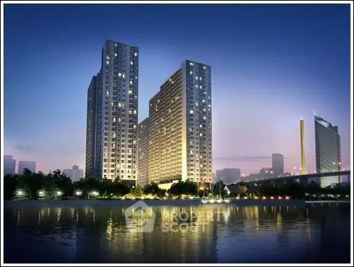 Stunning high-rise buildings with waterfront view at dusk, perfect for luxury urban living.