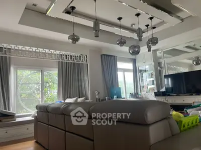 Luxurious living room with modern decor and large window view