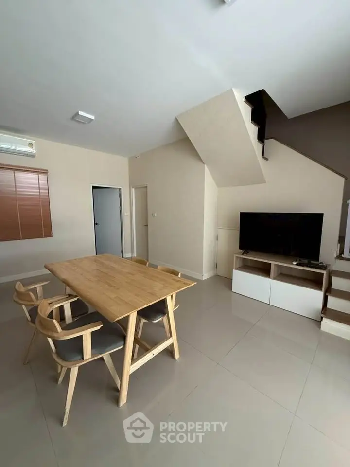 Modern living room with minimalist design and wooden furniture