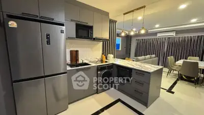 Modern kitchen with sleek appliances and open layout in stylish apartment