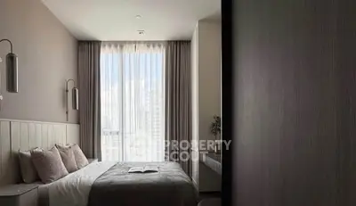 Modern bedroom with large window and elegant decor in a high-rise apartment.