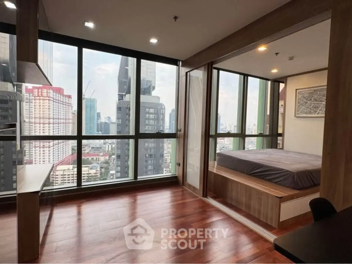 Modern high-rise condo with stunning city view and cozy bedroom