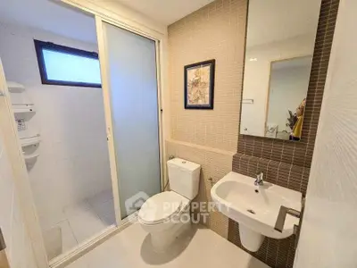 Modern bathroom with sleek design and sliding glass door