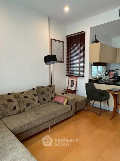 Cozy living room with modern decor and open kitchen layout