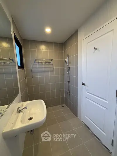 Modern bathroom with sleek tiles and minimalist fixtures