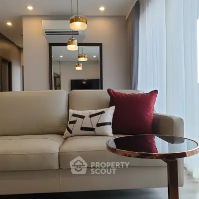 Modern living room with stylish sofa and elegant lighting