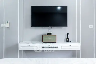 Modern living room with wall-mounted TV and stylish console table