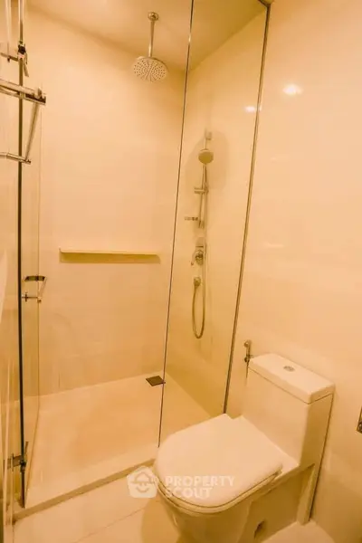 Modern bathroom with glass shower and sleek fixtures