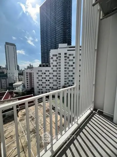 Stunning city view from a modern apartment balcony, perfect for urban living.