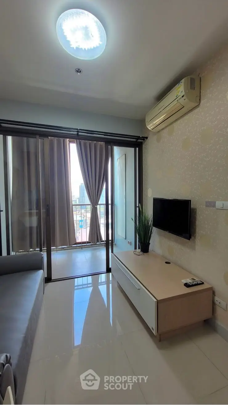 Modern living room with sleek design and city view balcony access.