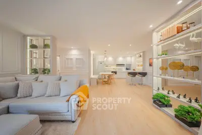 Spacious open-plan living room with modern kitchen and elegant decor