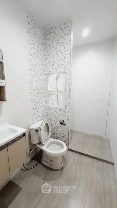 Modern bathroom with sleek design and stylish tile accents