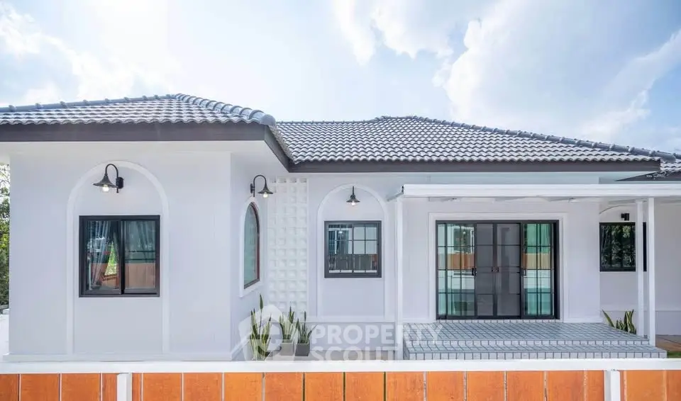 Modern single-story house with stylish exterior and large windows, perfect for contemporary living.