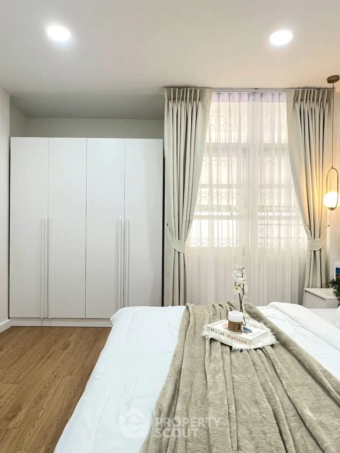 Elegant bedroom with modern decor and natural light