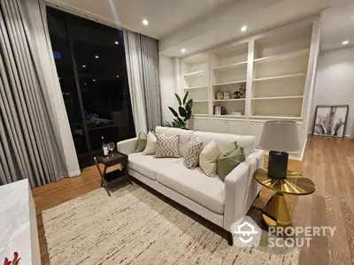 Elegant living room with modern furnishings, hardwood floors, and tasteful decor, perfect for upscale urban living.