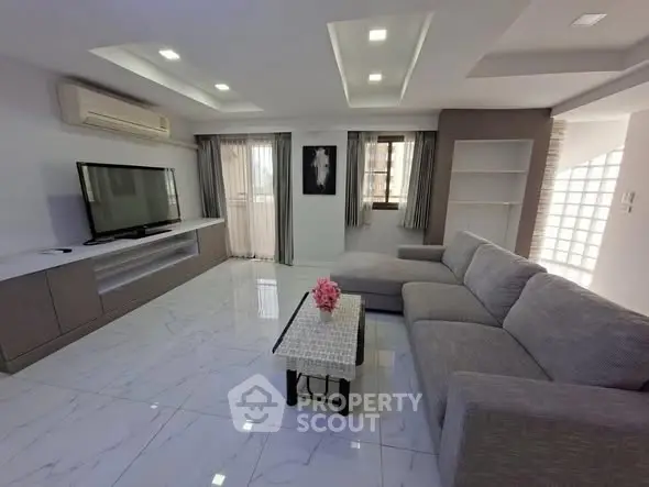 Spacious modern living room with sleek design and large sectional sofa