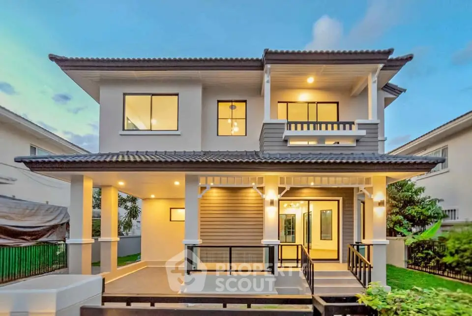 Stunning two-story modern home with elegant facade and spacious balcony, perfect for family living.