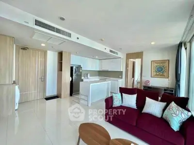 Spacious modern living room with open kitchen and elegant decor