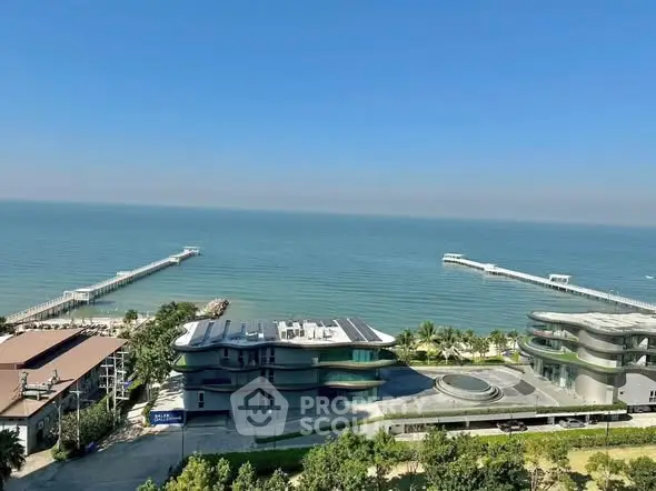Stunning oceanfront view from luxury apartment with modern architecture and private piers.