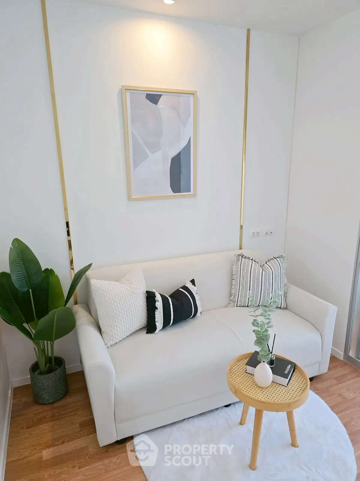 Chic modern living room with cozy white sofa and stylish decor