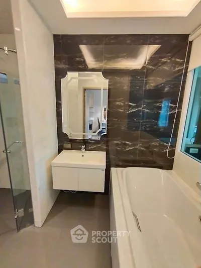 Luxurious bathroom with elegant marble walls and modern fixtures