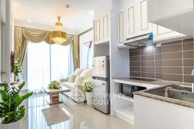 Luxurious open-plan living room and kitchen with elegant decor and natural light