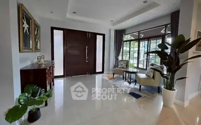 Elegant living room with large windows and stylish decor