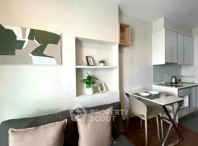 Modern compact living room with integrated kitchen and stylish decor