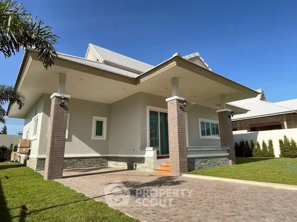 Charming single-story home with spacious front yard and modern exterior design.