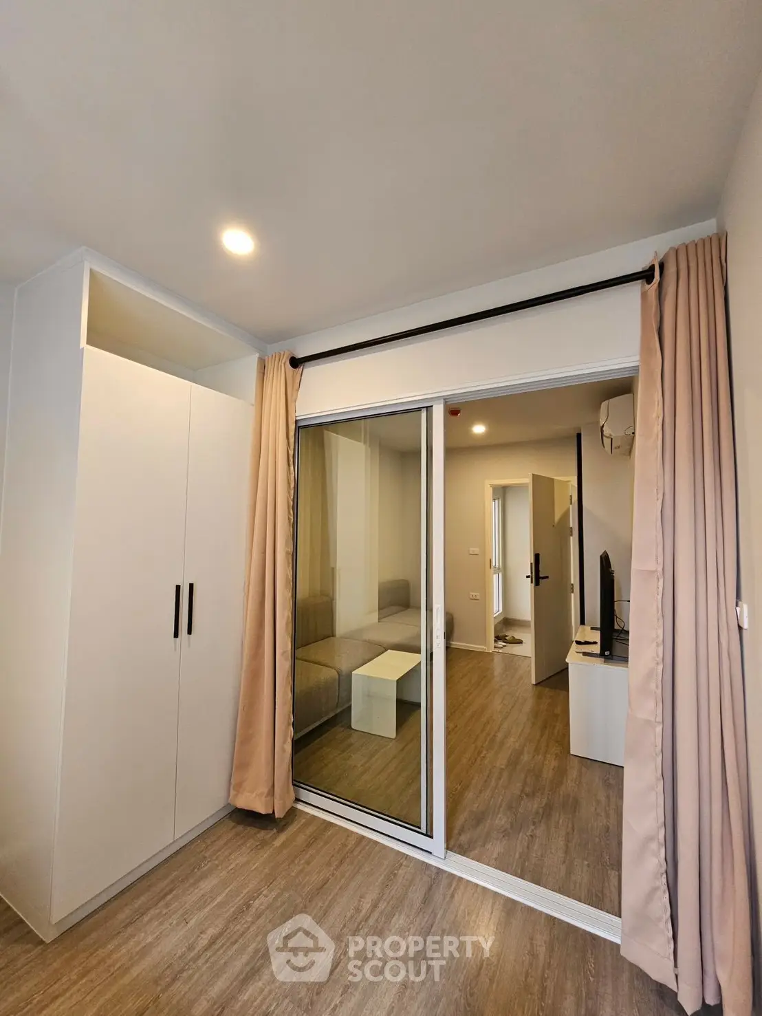 Modern apartment interior with sliding glass doors and stylish decor