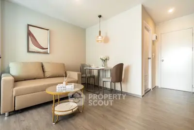 Modern living room with stylish decor and cozy seating area in a contemporary apartment.