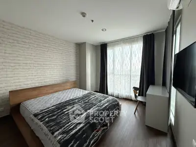 Modern bedroom with large window and stylish decor