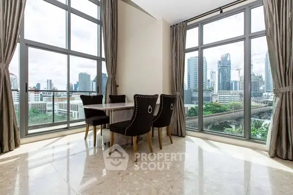 Stunning corner unit dining area with panoramic city views and elegant decor.