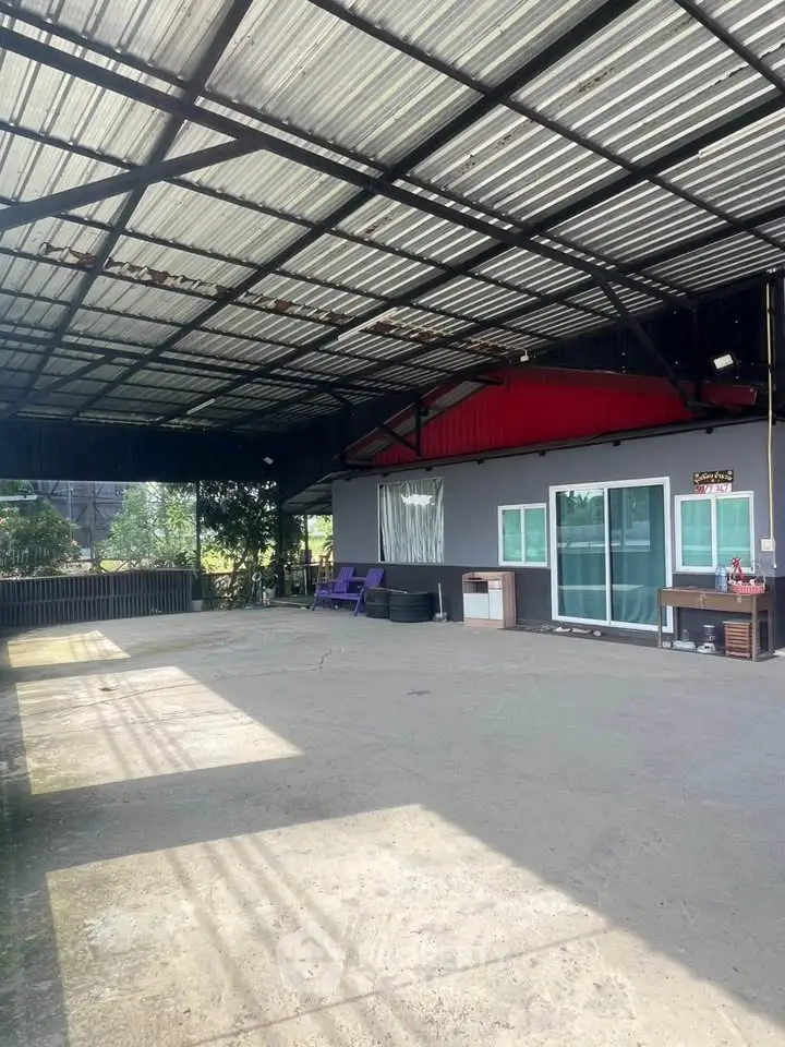 Spacious covered outdoor area with modern design and ample natural light.